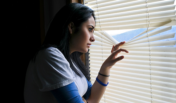 woman-checking-for-burglar